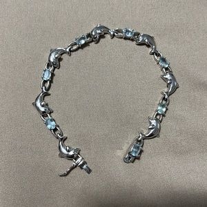 Dolphin tennis bracelet w/ light sapphire stone